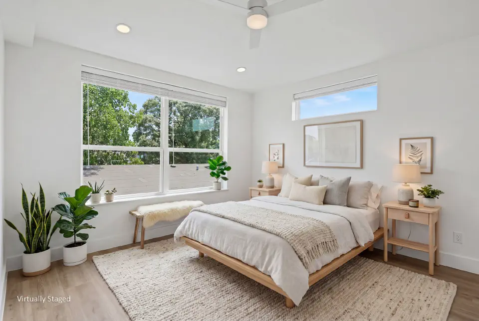 Corner bedroom with oversized windows and abundant natural light