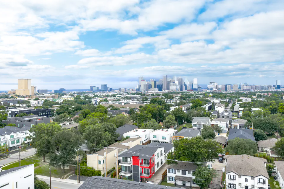 Aerial view of Jasmine@Fitzhugh and the surrounding neighborhood with the Dallas skyline