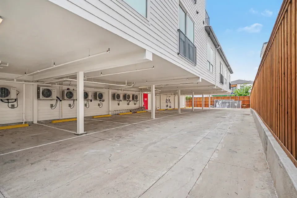 Assigned covered parking area behind the residences