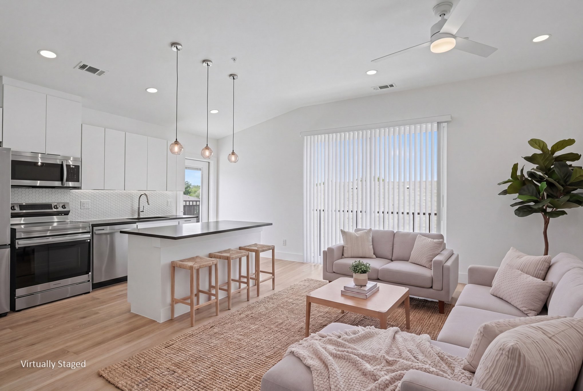 Kitchen and living area at Jasmine@Fitzhugh