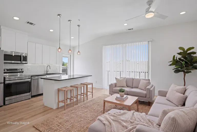 Kitchen and living area at Jasmine@Fitzhugh